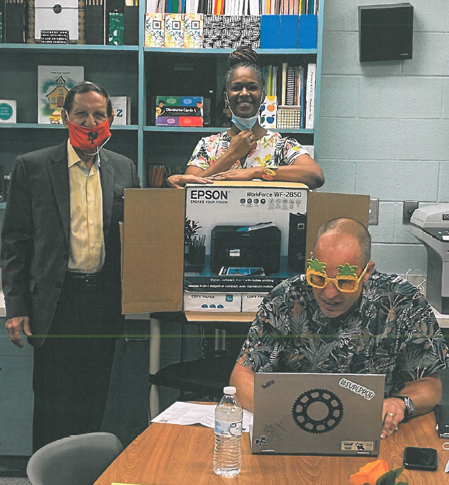 Bob Davis brings a color printer to Palm Terrace Elementary